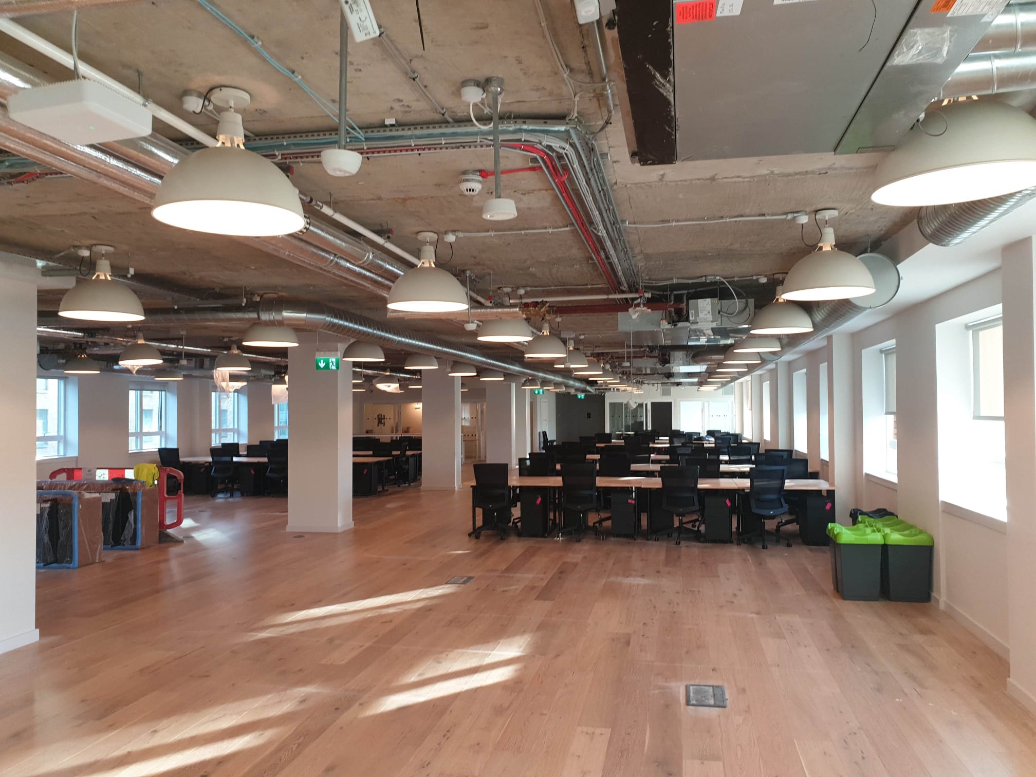 Open-plan office with pendant lighting